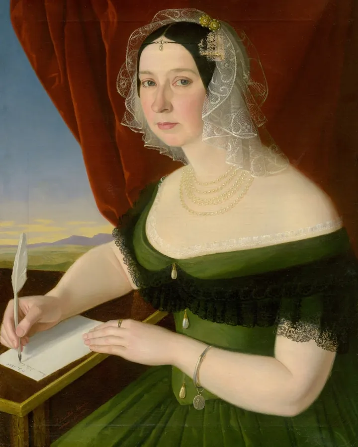 Painting of a woman in green writing a letter with a quill